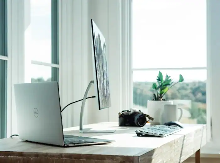 Gaming desk with laptop showing game guide content